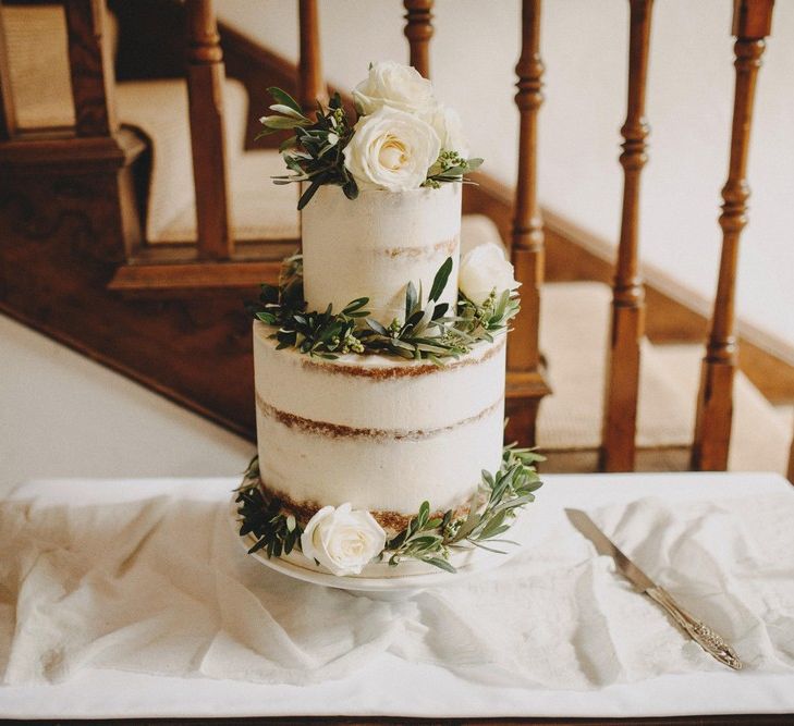 White Semi Naked Buttercream Wedding Cake / Image By Ali Paul Photography