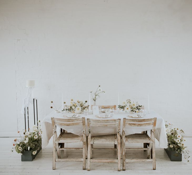 minimalist tablescape with white wash chairs and tables