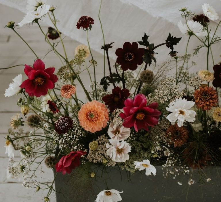 Deep red, orange and white wedding flower stems wedding decor