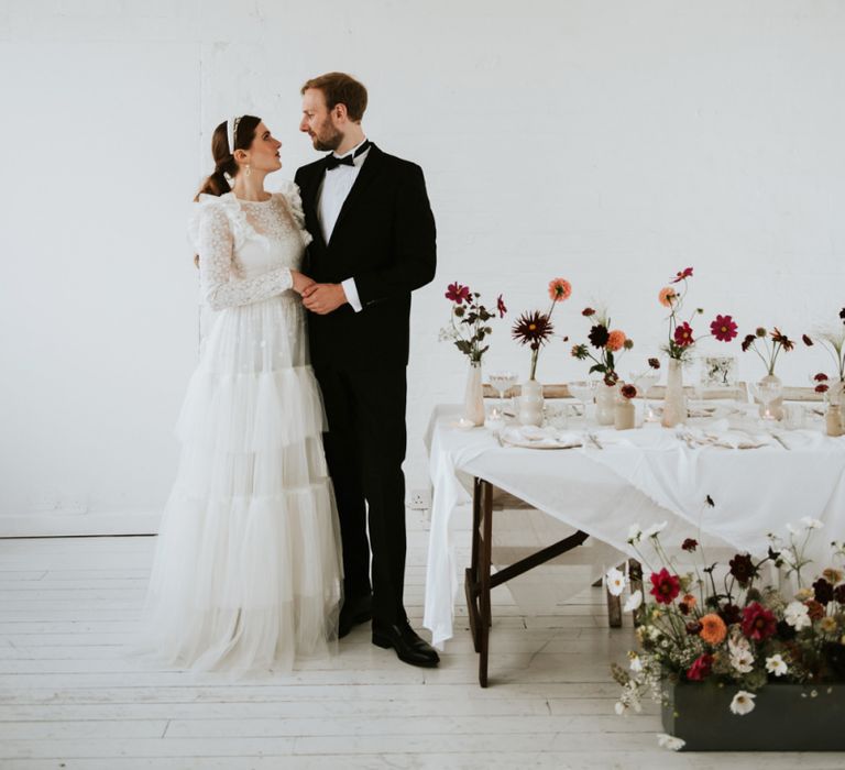 Stylish bride and groom at minimalism wedding