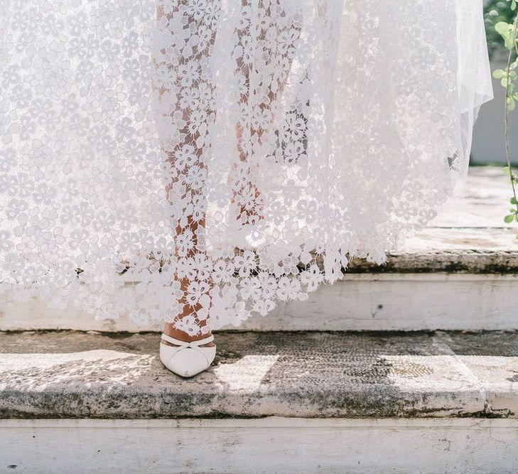 Bride in Lace Andrea Sedici Wedding Dress Walking Down the Steps