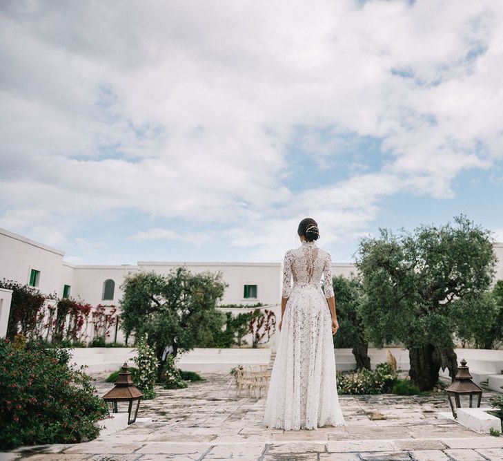 Bride in Lace Andrea Sedici Wedding Dress Standing at the Outdoor Ceremony