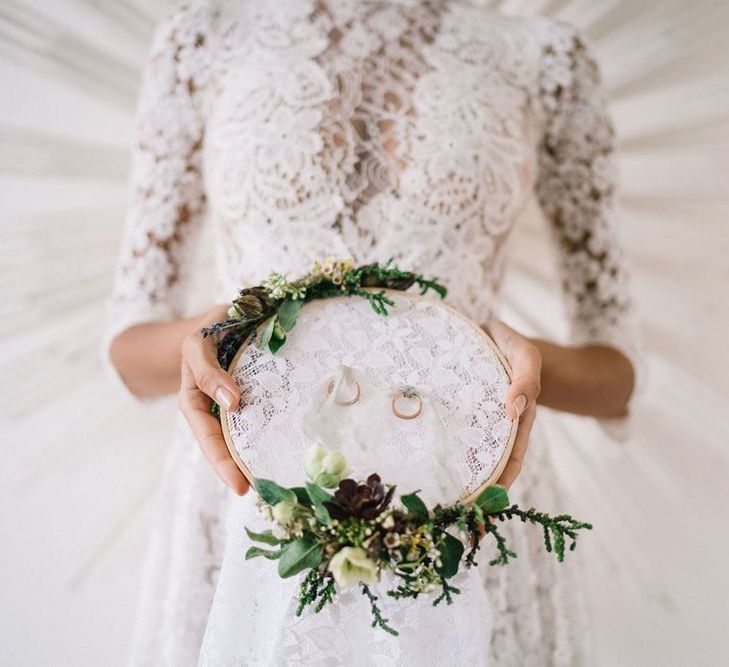 Wedding Rings Tied to Lace and Floral Covered Embroidery Hoop