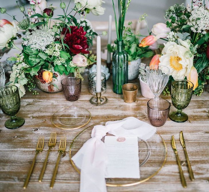 Elegant Place Setting with Glass Charger Plate and Gold Cutlery