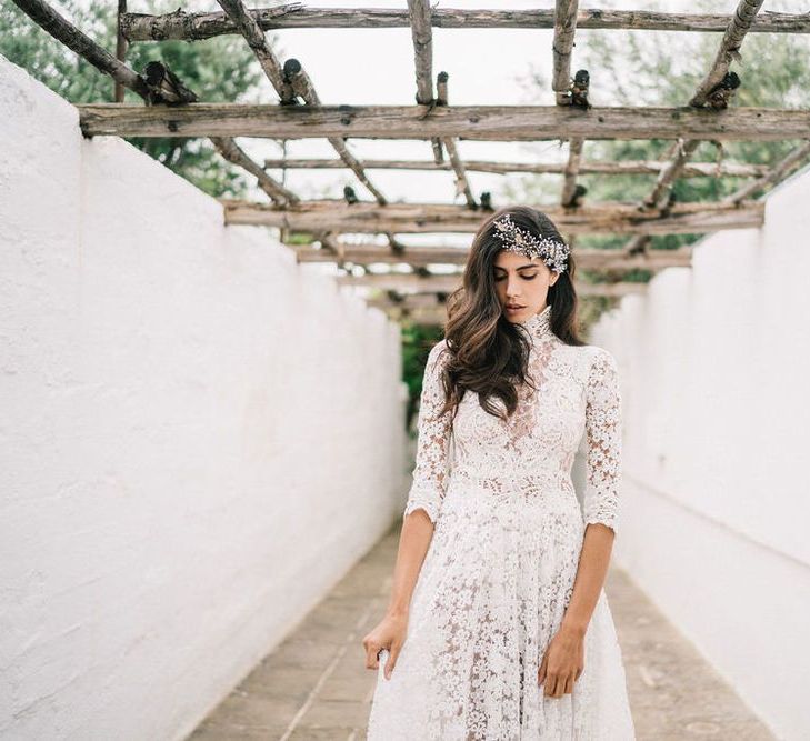 Bride in Lace Wedding Dress with High Neck and Three Quarter Sleeves