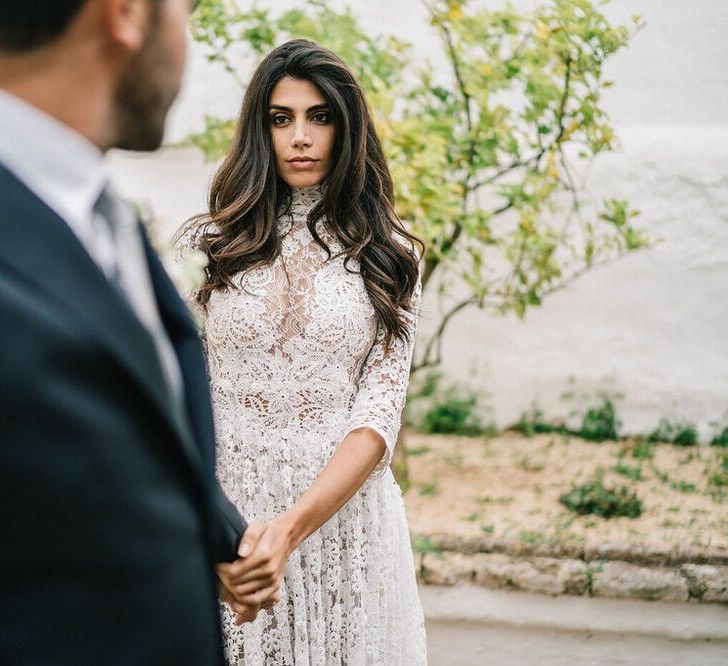 Bride in Lace Wedding Dress with Long Wavy Hair