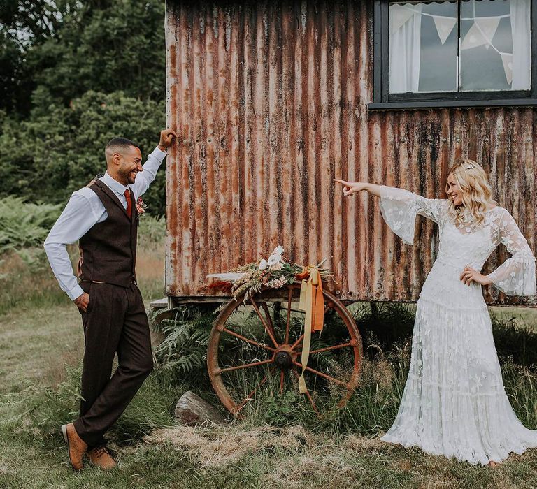 Bride and Groom Posing by a Corrugated Iron Shed