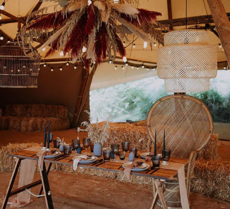 Tipi Reception Table with Wicker Peacock Chair and Pampas Grass Installation