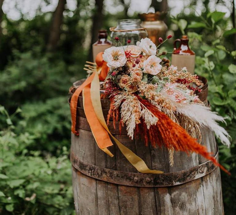 Orange and Neutral Flower Wedding Bouquet Tied With Ribbons