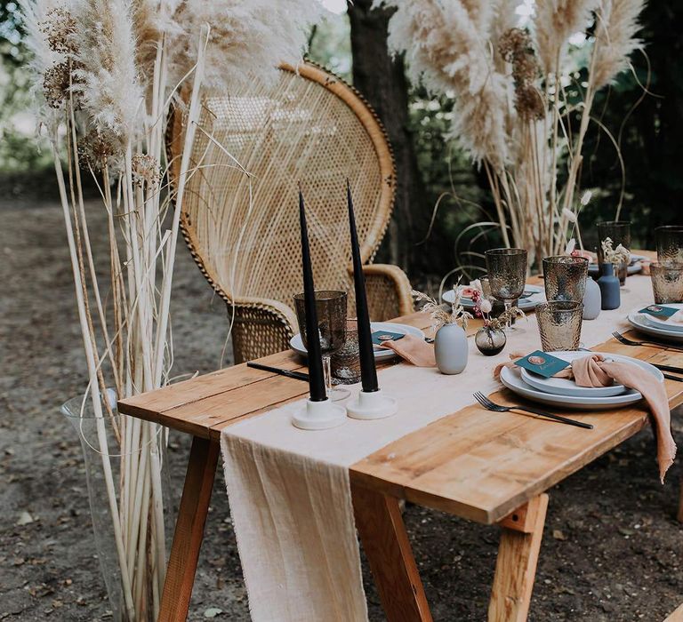 Intimate Tablescape with Dried Flowers and Grasses, Coloured Table Ware and Wooden Table