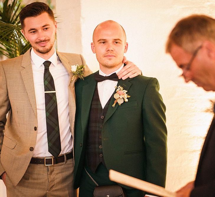 Grooms listen to wedding readings