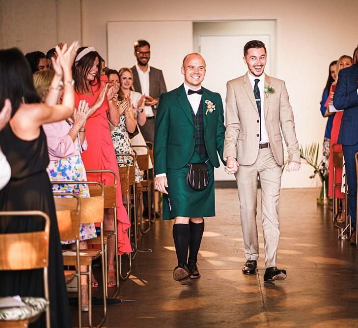 Groom in kilt walking down the aisle