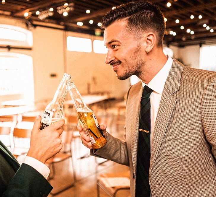 Grooms toast their wedding at  Trinity Buoy Wharf