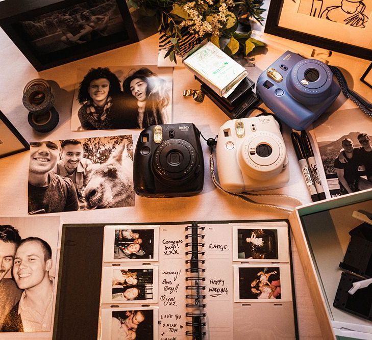 Polaroid camera table at wedding