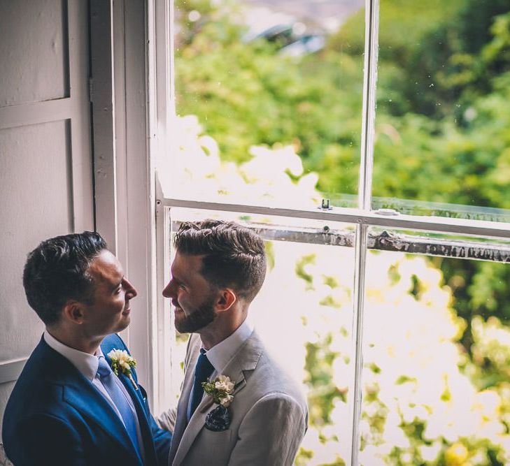 The Roost Dalston same-sex wedding with vintage decor colourful signage and white blazer