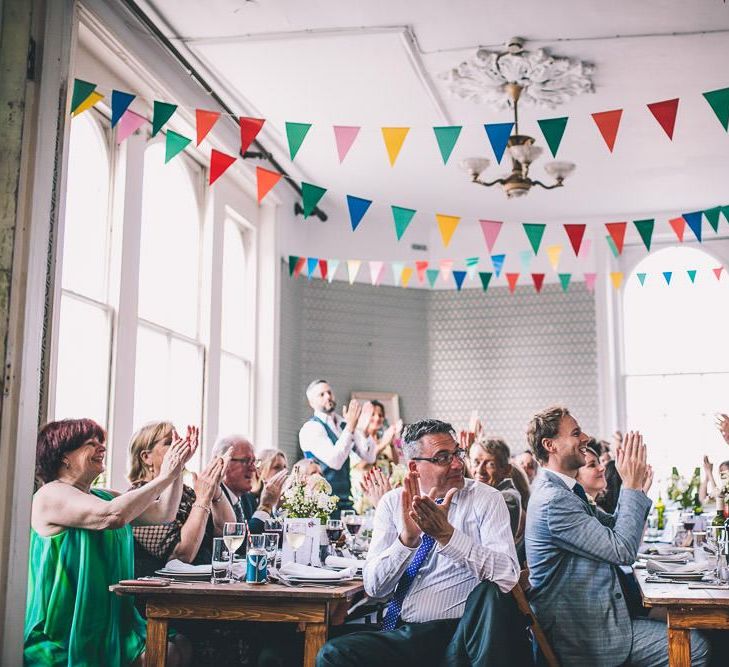 The Roost Dalston intimate wedding reception with vintage decor and colourful bunting