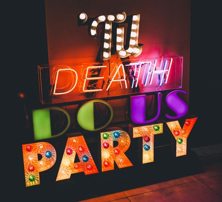 'Til death do us party colourful sign at colourful reception with vintage styling