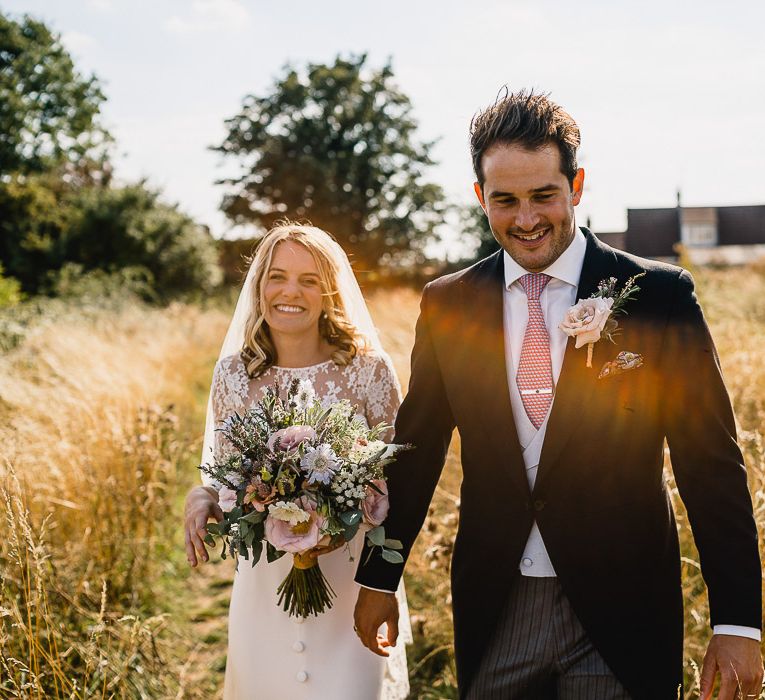 Bride In Bespoke Dress // Groom In Oliver Brown // Coastal Inspired Marquee Wedding With Bride In Bespoke Dress And Bridesmaids In Rewritten Wrap Dresses Images By Luis Holden