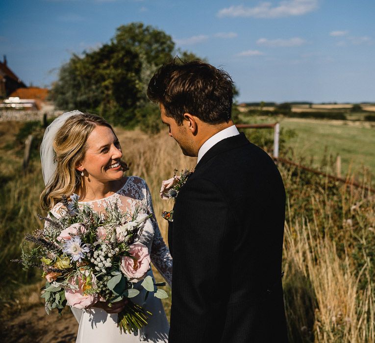 Bride In Bespoke Dress // Groom In Oliver Brown // Coastal Inspired Marquee Wedding With Bride In Bespoke Dress And Bridesmaids In Rewritten Wrap Dresses Images By Luis Holden