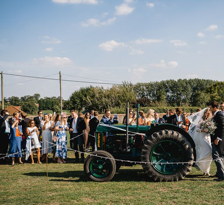 Tractor Wedding Transport // Coastal Inspired Marquee Wedding With Bride In Bespoke Dress And Bridesmaids In Rewritten Wrap Dresses Images By Luis Holden