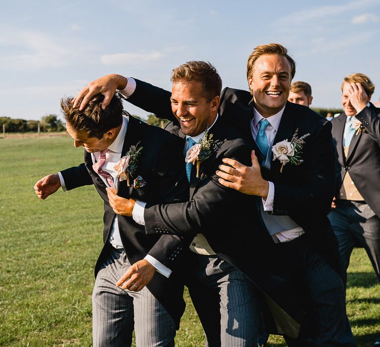 Groomsmen With Blue Ties For Wedding // Coastal Inspired Marquee Wedding With Bride In Bespoke Dress And Bridesmaids In Rewritten Wrap Dresses Images By Luis Holden