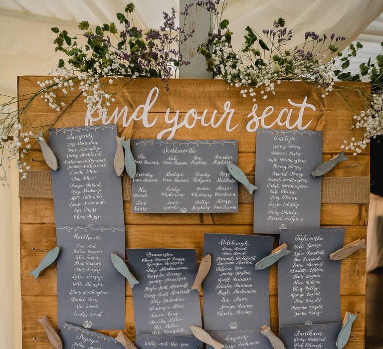 Rustic Coastal Themed Table Plan // Bride In Bespoke Dress // Groom In Oliver Brown // Coastal Inspired Marquee Wedding With Bride In Bespoke Dress And Bridesmaids In Rewritten Wrap Dresses Images By Luis Holden