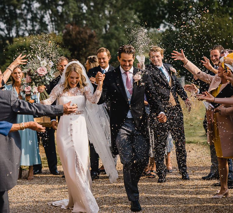 Confetti Shot // Coastal Inspired Marquee Wedding With Bride In Bespoke Dress And Bridesmaids In Rewritten Wrap Dresses Images By Luis Holden