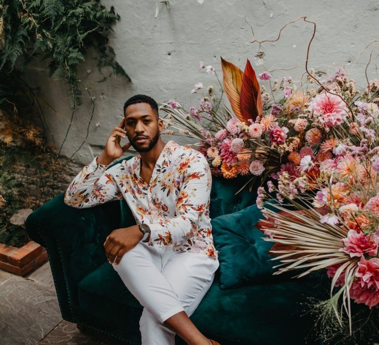 Groom in floral shirt and white trousers at Secret Garden Kent