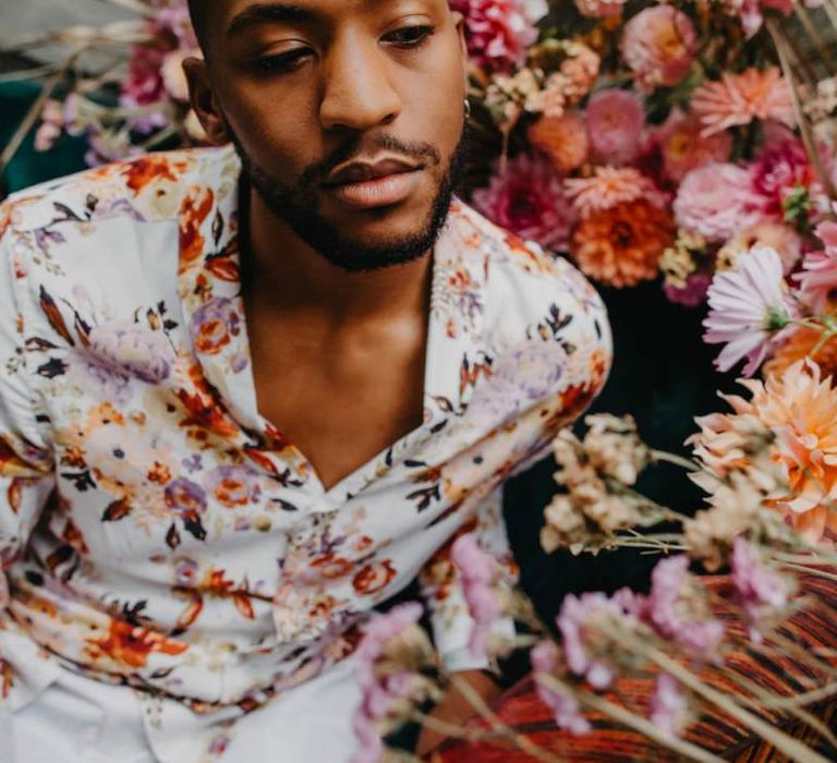 Groom in floral shirt for tropical wedding inspiration