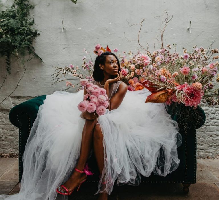 Stunning bride in tulle wedding dress with pompom dahlia wedding bouquet