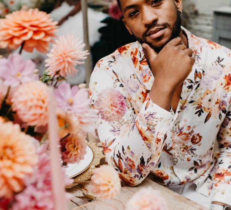 Groom in floral shirt at intimate wedding