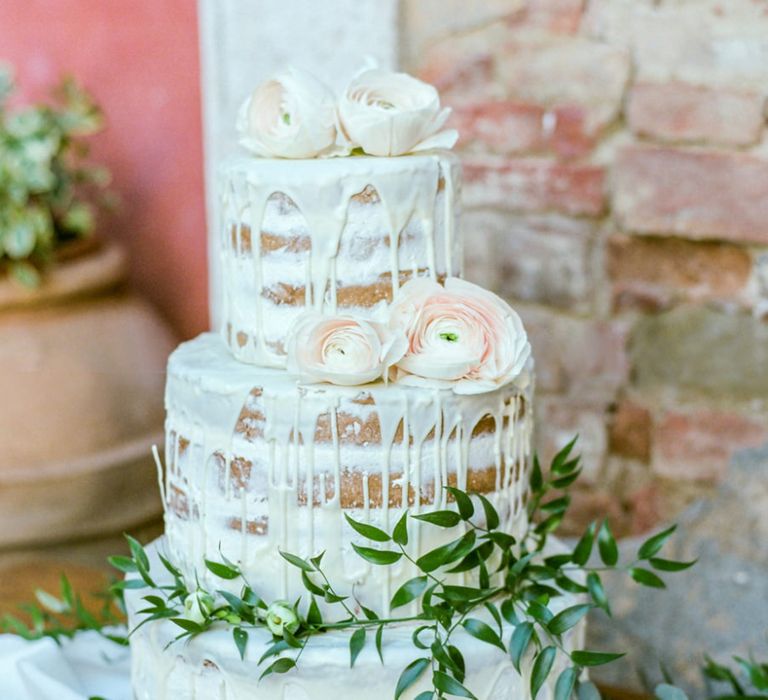 Semi Naked Wedding Cake with Drip Icing Decorated with  Foliage and Flowers