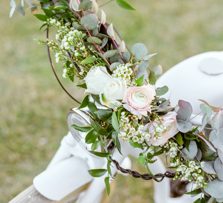 Romantic Wedding Flowers Decorating the Handle Bars of the Vintage Bicycle