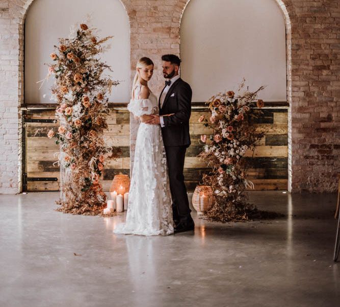 Bride in Emma Beaumont wedding dress inside Iscoyd Park Coachhouse