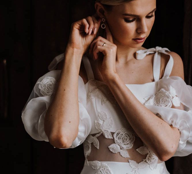 Bride in Emma Beaumont wedding dress with appliqué detail