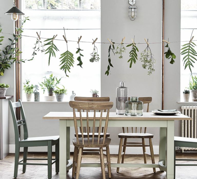 Dining Table with Mis-Match Chairs &amp; Hanging Leaves Decor