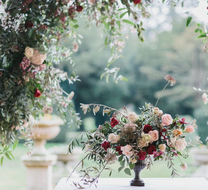 Blush &amp; Burgundy Floral Arrangement | Fairytale Wedding Inspiration at Grittleton House Planned &amp; Styled by Jennifer Louise Weddings | Katherine Yiannaki Photography