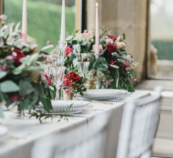 Reception Table Decor with Taper Candles &amp; Low Floral Arrangements | Blush &amp; Burgundy Floral Fairytale Wedding Inspiration at Grittleton House Planned &amp; Styled by Jennifer Louise Weddings | Katherine Yiannaki Photography