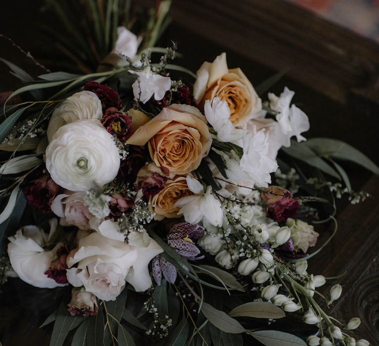 Beautiful Wedding Bouquet with White Ranunculus Flowers  and Soft Muted  Peach Roses and Foliage