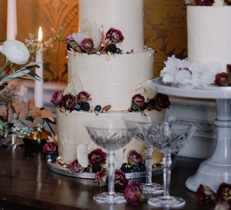 Three Tier Frosting Wedding Cake with Red Flower Decor