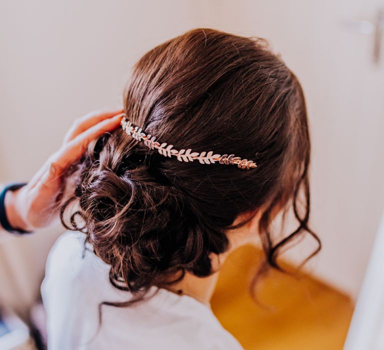 Rose gold hair vine in bridal pinned updo