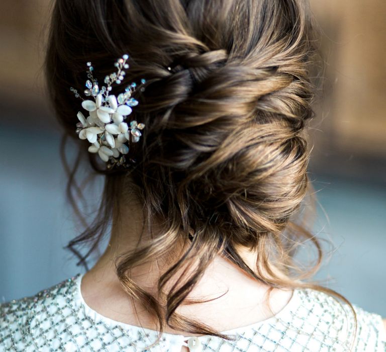 Romantic, loose, side parted updo