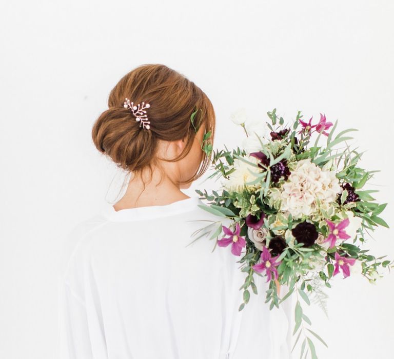 Loose low bun bridal hairstyle