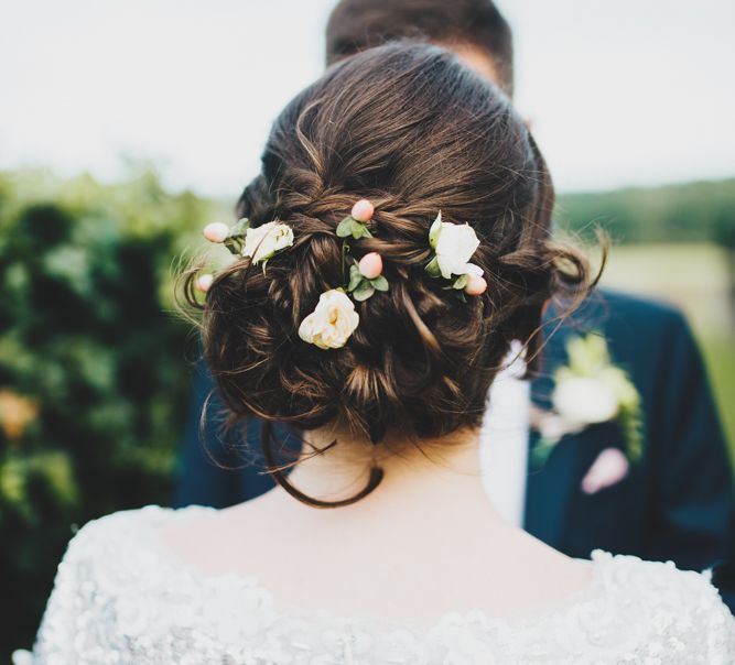 Berries and flowers in brides hair