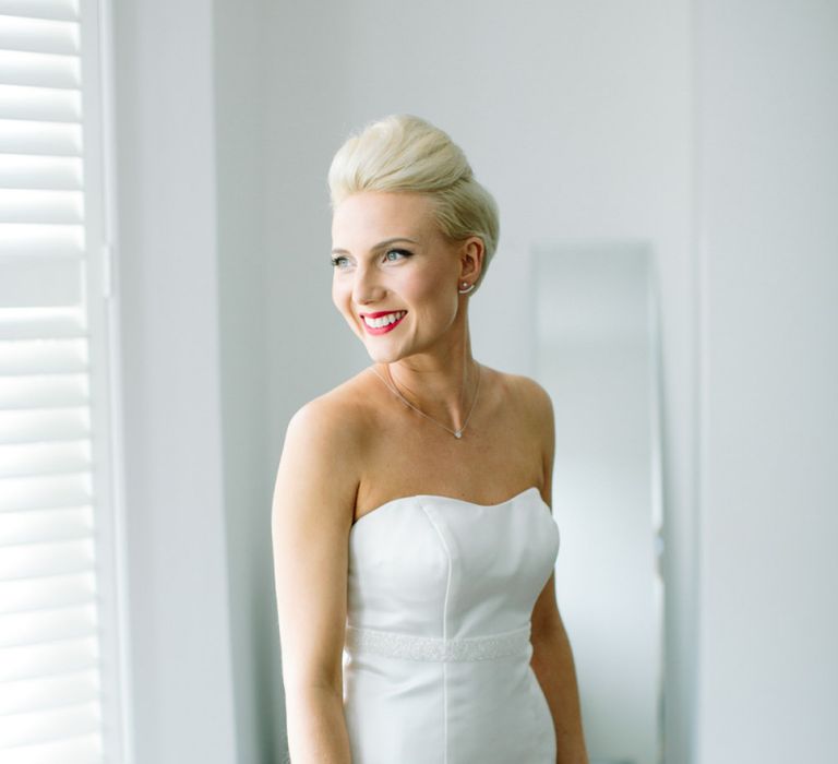 Short haired bride with hair pinned into an updo