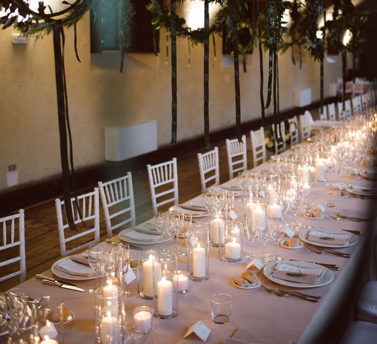 Greenery Hanging Hoops &amp; Candle Light Wedding Reception Decor | Green &amp; White Bohemian Wedding in the Rain at Castello di San Sebastiano da Po, Italy | Margherita Calati Photography | Second Shooter Carlo Vittorio