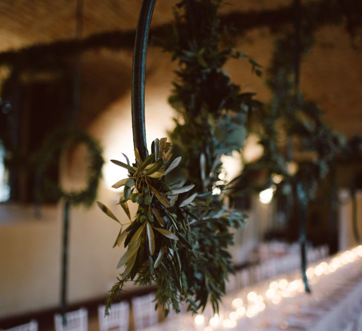 Greenery Hanging Hoops &amp; Candle Light Wedding Reception Decor | Green &amp; White Bohemian Wedding in the Rain at Castello di San Sebastiano da Po, Italy | Margherita Calati Photography | Second Shooter Carlo Vittorio