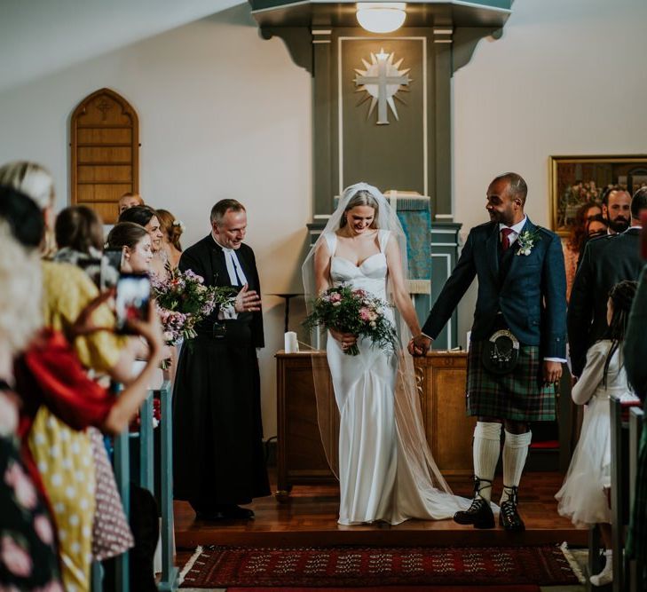 Bride and groom during church ceremony