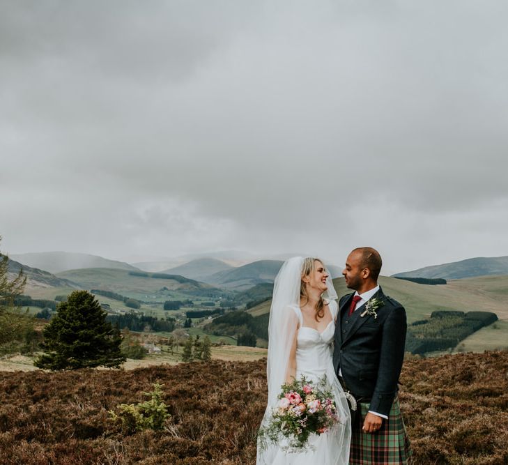 Scottish wedding with marquee decorated in hanging flowers