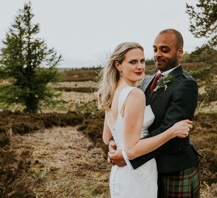 Scottish wedding with marquee decorated in hanging flowers